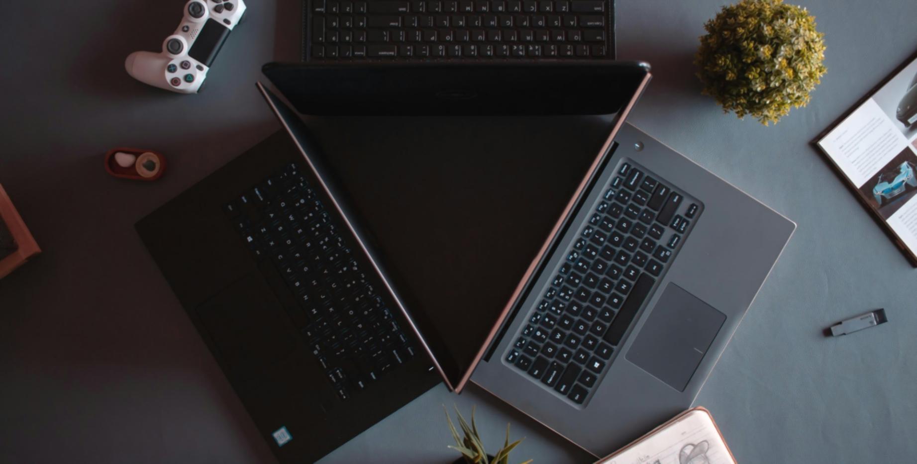 Developer working on code with multiple screens